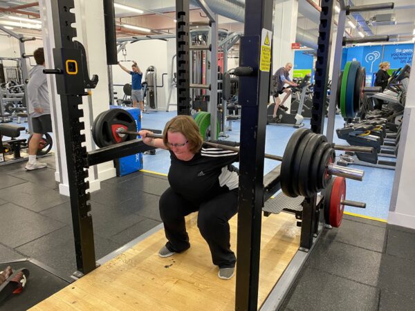 Personal training client doing Squats